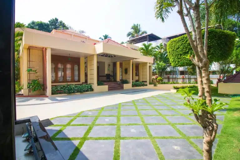 Rzian Homez landscaping in Trivandrum: Grass-paver courtyard